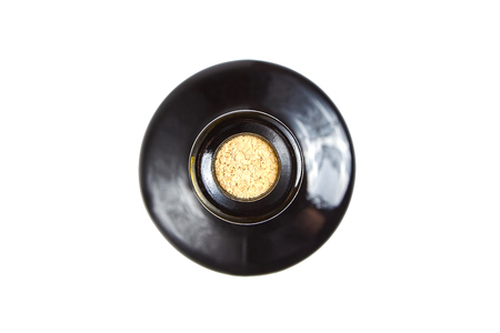 corked glass bottle of red wine, top view, isolated on white backgroundの写真素材