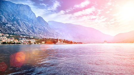 Cruise liner near the coast and a beautiful city in the mountains. Large tourist ship in sea. European Mediterranean Landscapeの写真素材
