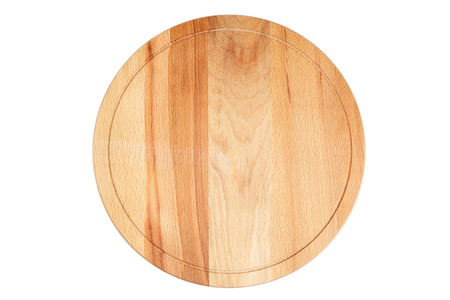 Round wooden beech cutting board isolated on white backgroundの写真素材
