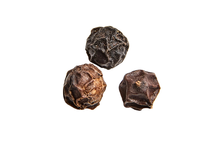 Black peppercorns on white background isolatedの写真素材