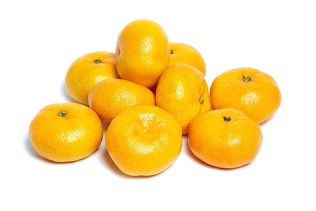 Heap tangerine or mandarin citrus fruit isolated on white backgroundの写真素材
