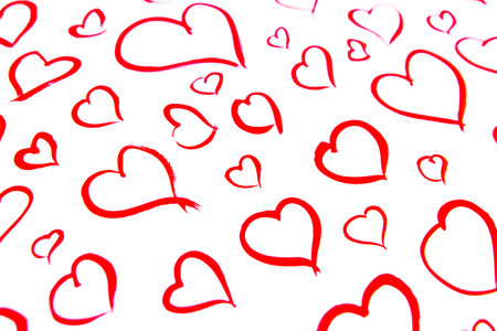 Image of red hearts painted on white sheet of paper. Love concept