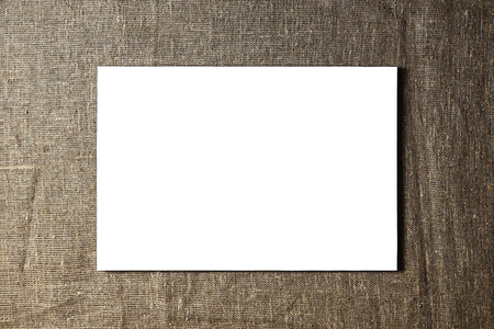 pure white synthetic canvas stretched on a wooden stretcher on sackcloth fabric texture background. Art, creativity, hobby, job and creative occupation conceptの写真素材