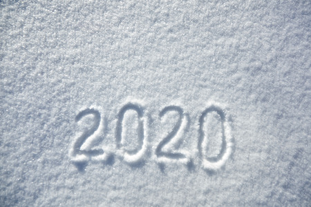 winter inscription 2020 New Year background, text on snow surfaceの写真素材