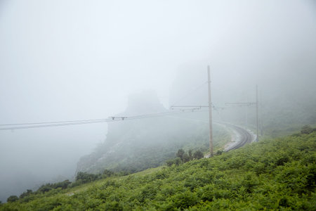 Ð¡og railway in the foggy weather. La Rhune, Basque Mountain, Franceの写真素材
