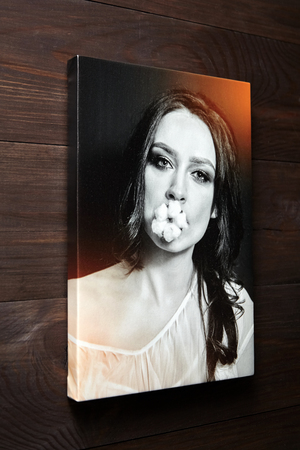 Canvas print with gallery wrapping. Photography of woman stretched on stretcher bar, lateral side. Wall decorの写真素材