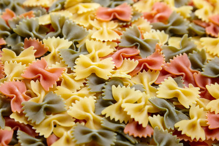 Uncooked Farfalle Tricolore Pasta background
