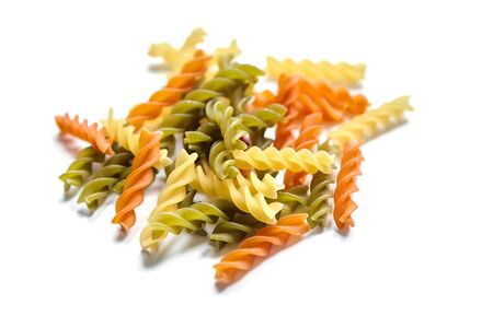 Fusilli tricolore traditional italian pasta isolated on a white backgroundの写真素材