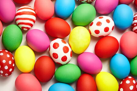 Colorful Easter eggs background. Christian holiday traditions. Traditional symbol. Ceremonial foodの写真素材