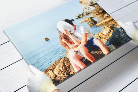 Photography printed on canvas with gallery wrap method of canvas stretching. Photo of kissing couple in love is in male handsの写真素材