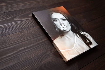 Photo canvas print. Gallery wrap, photography printed on glossy synthetic canvas and stretched on wooden stretcher bar, lateral sideの写真素材