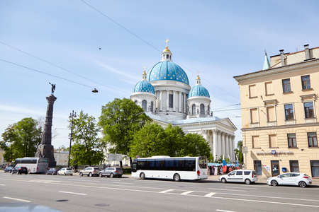 Saint Petersburg, Russia - May 20, 2019: The Trinity Cathedral (Troitsky Sobor) Guards Izmailovsky Regiment is architectural landmark of the city. Facade, roof with blue domes and tour bus on streetのeditorial素材