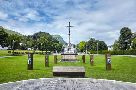 Lourdes, France - June 18, 2018: The Sanctuary of Our Lady of Lourdes or the Domain. Crucifix, Jesus on the cross. Summer dayのeditorial素材