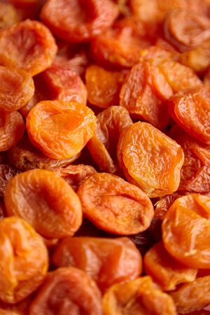 Dried apricots texture background. Heap of dry apricot fruits, selective focusの写真素材