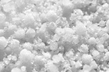 Graupel, snow pellets or soft hail texture, background, macro. Form of precipitation. Graupel has shape of small white balls, closeup, selective focusの写真素材