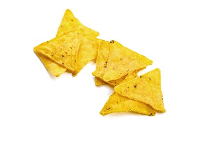 nachos, corn chips, snack isolated on white background. Scattered fast food, suitable for vegetarians. Traditional mexican food. Selective focusの写真素材