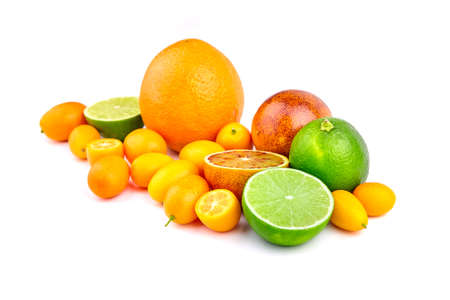 Fresh citrus fruits isolated on white background. Heap of tropical fruits, summer harvest. Citrus mix - half blood orange, lime, kunquats, orange.の写真素材