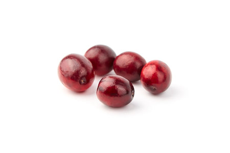 cranberries isolated on white background. Heap of fresh red berries. Autumn large cranberries