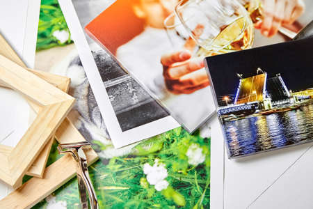 Canvas photo print on white wooden background. Sample of gallery wrapping method of canvas stretching on stretcher bar. Corner of colorful photographyの写真素材