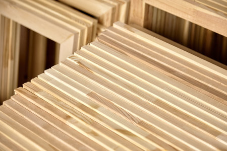 Stretcher bars, stack of wooden frames for canvases. Stacked subframes. Production wrap stretcher...