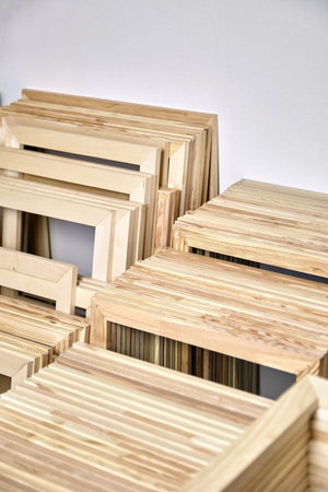 Stretcher bars, stack of wooden frames for canvas wrap.