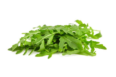 Heap of green rucola, arugula or rocket salad isolated on white backgroundの写真素材