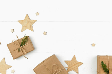 Christmas composition with gift boxes and wooden decoration on white background.の写真素材