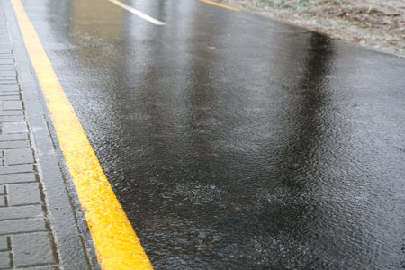 Ice crusted ground, icy road, slippery street, winter weatherの写真素材