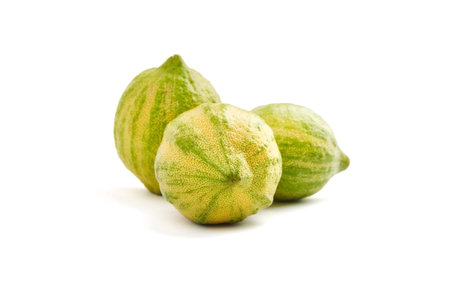 Pink lemons or Variegated Eureka lemons isolated on white background. Three citrus fruits with...