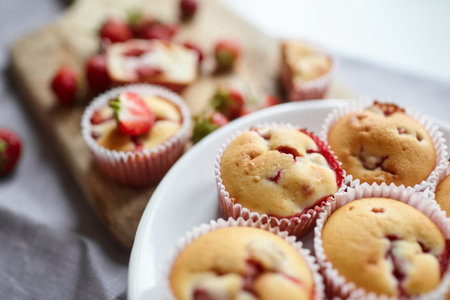 Strawberry muffins with fresh strawberries - sweet summer healthy dessertの写真素材