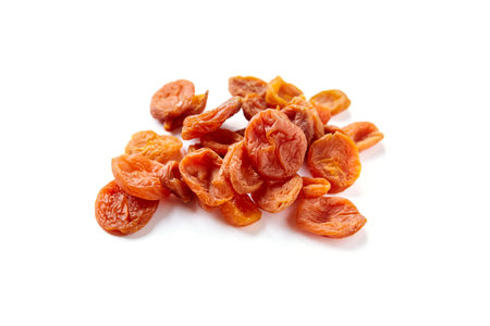 Dried apricots isolated on white background. Heap of dry apricot fruits, selective focusの写真素材