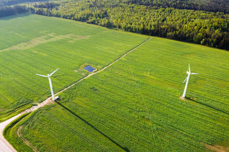 Wind turbines in green field, aerial view. Green energy, renewable energyの写真素材