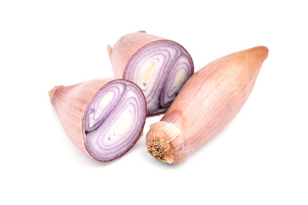 Shallot onions isolated on white background. Halved banana shallot