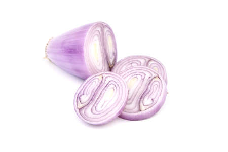 Shallot half and slices isolated on white background. Fresh peeled Banana Shallot onionの写真素材