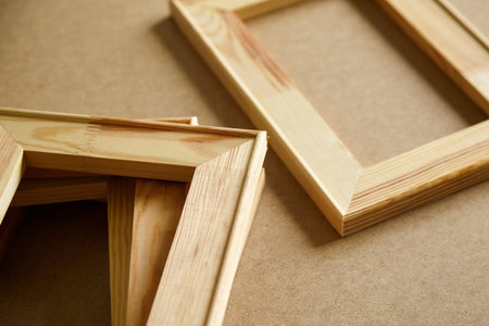 Stretcher bars on table. Stacked wooden framesの写真素材