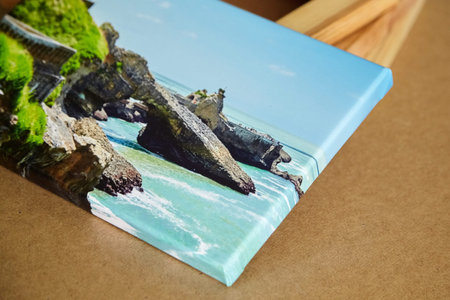 Photo canvas print mounted with gallery wrap and stacked stretcher bars on fiberboard table....