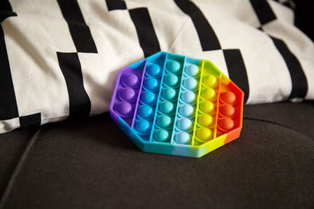 Push pop bubble sensory fidget toy octagon shape on pillowの写真素材