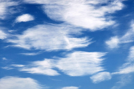 Blue sky with white spindrift clouds