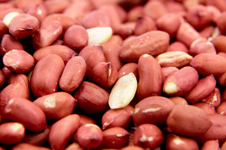 Peeled raw peanuts food background closeup