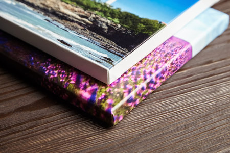 Canvas photo prints stretched onto frame with bleed and white edge on wooden table