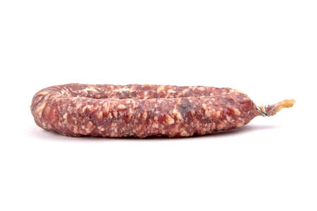 Dry cured pork sausage ring isolated on white backgroundの写真素材