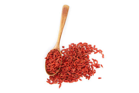 Dried goji berries in wooden spoon isolated on white background top viewの写真素材