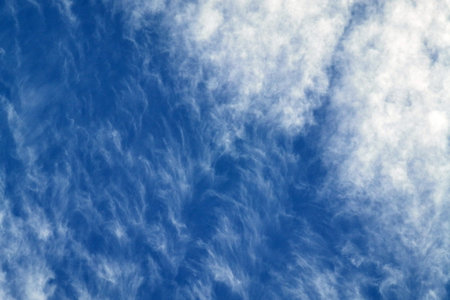 Blue sky with white spindrift clouds