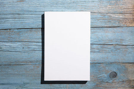 Canvas mockup, white blank picture hanging on blue old wooden wall with dark shadows. Poster mock...