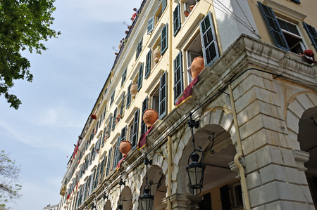 CORFU, GREECE - APRIL 18, 2009: At 11:00am on Holy Saturday, as is customary, Corfians throw water filled jugs and pots from balconies at the Liston Spaniada promenade on Holy Saturday, to celebrate the Resurrection.のeditorial素材