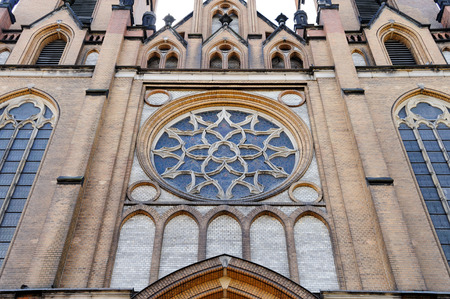 Holy Virgin Mary Cathedral's dominant rosette with stained glass on the facade above the entrance in Radom, Polandのeditorial素材