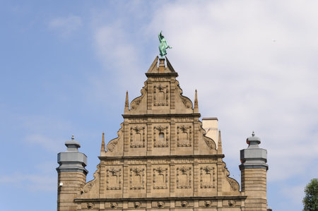 TORUN, POLAND - JULY 7, 2009: Gable of the Collegium Maximum building of the Nicolaus Copernicus University with the statue of fortune at the topのeditorial素材