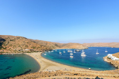 Panoramic view of the Kolona double sided beach at Kythnos, Greece as viewed from Aghios Loukas isletの写真素材