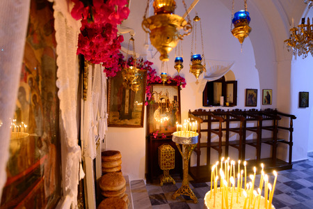 KYTHNOS, GREECE - AUGUST 14, 2014: Bread left in front of the iconostasis (templon) of the church of Panagia Stratolatissa, to be blessed by the priest during the Assumption liturgyのeditorial素材