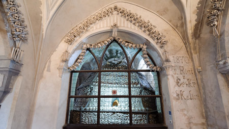 KUTNA HORA, SLOVAKIA - JULY 8, 2009: Sedlec Ossuary (aka Church of Bones) beneath the Cemetery Church of All Saints, contains over 40,000 skeletons whose bones are artistically arranged as decorationsのeditorial素材
